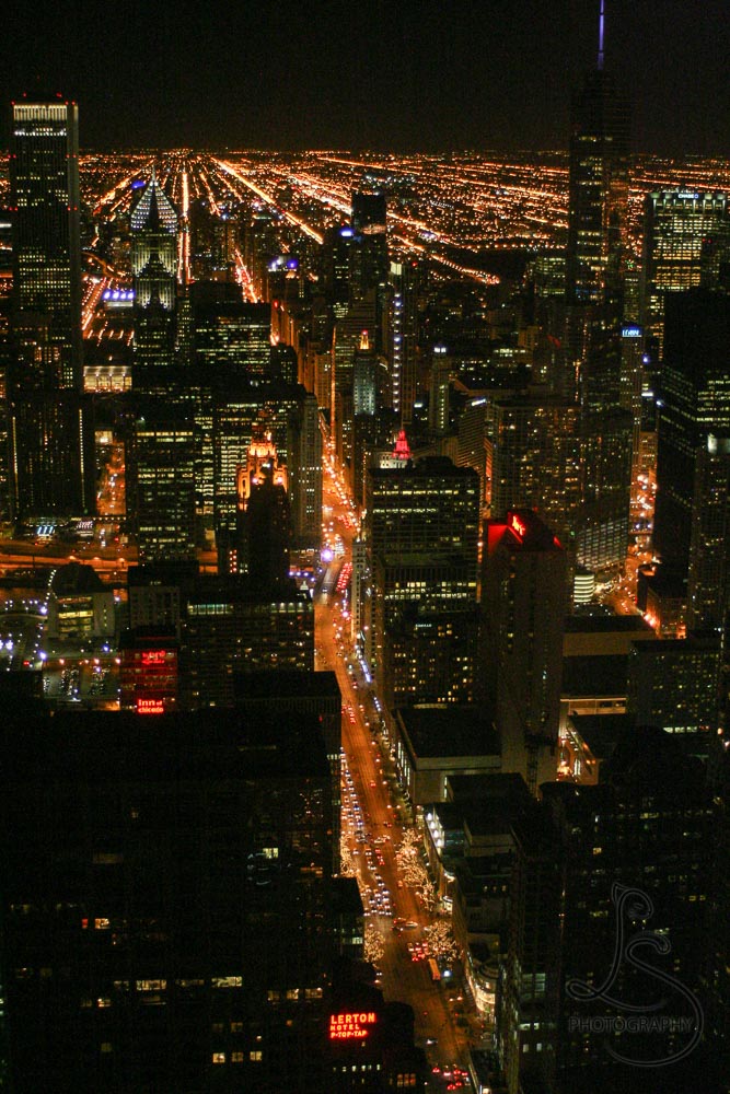Nighttime Chicago city from atop the Hancock Tower | LotsaSmiles Photography