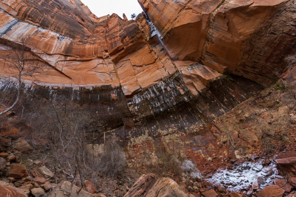 The cliff face at the snow-fringed upper emerald pool