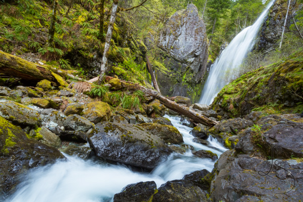 A tall waterfall, flowing toward the viewer | LotsaSmiles Photography
