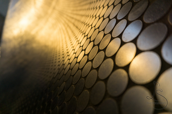 Detail shot of the circular tiles under Portland's Tilikum Crossing, reflecting the morning sunlight | LotsaSmiles Photography