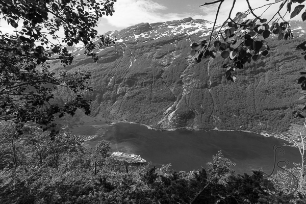 The first views of the water of Geiranger Fjord as a cruise ship passes by, in monochrome | LotsaSmiles Photography